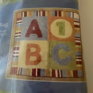 Brand new Cocalo alphabet soup decorative rug 100% cotton!  Kids area rug.